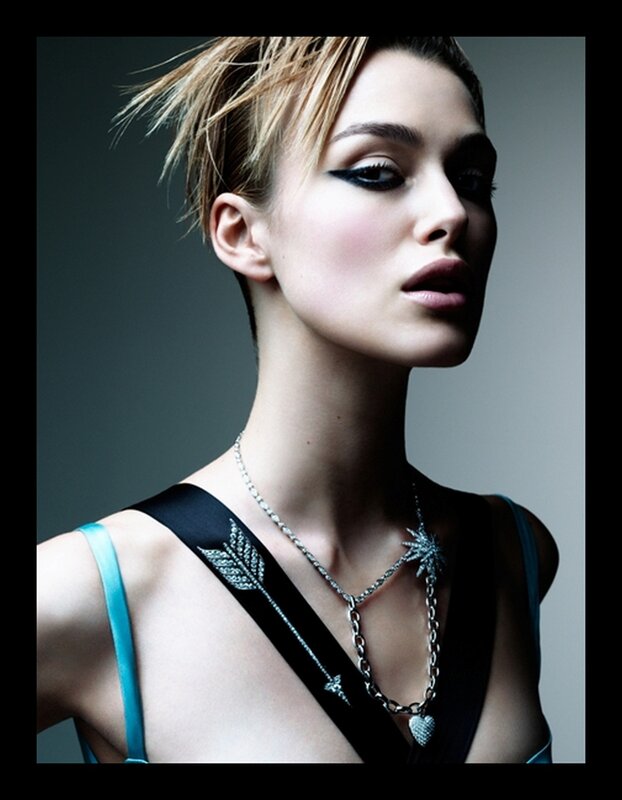 woman with bold makeup and jewelry