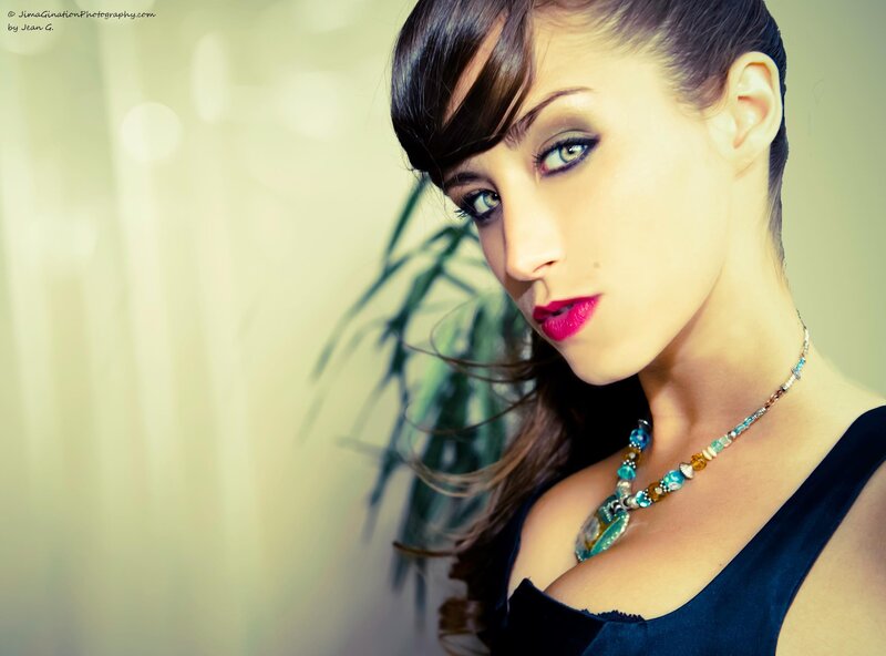 woman with bold makeup and necklace