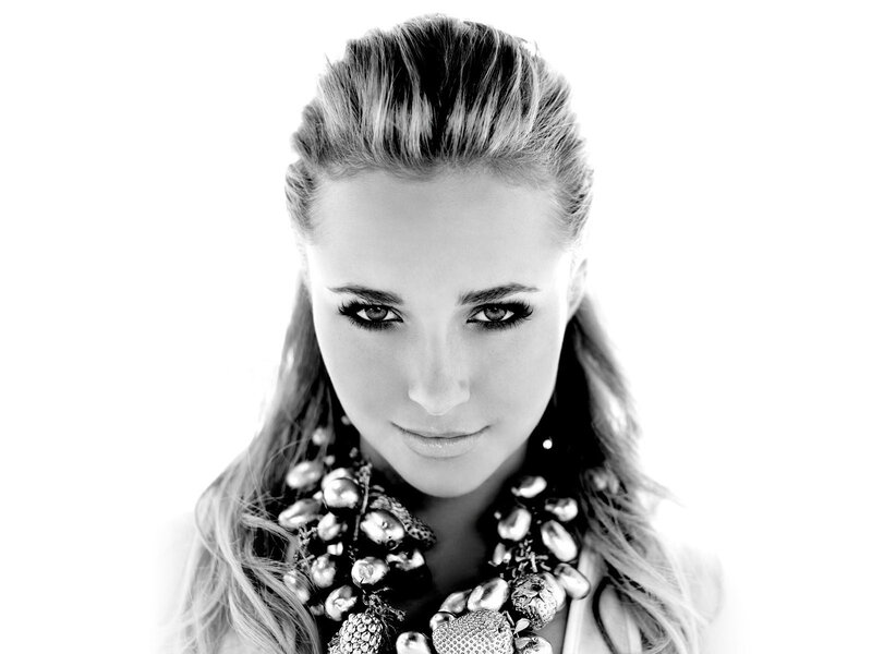 woman with bold makeup and necklace