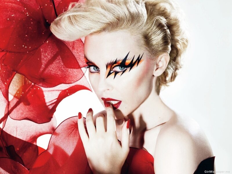 woman with bold makeup and red fabric