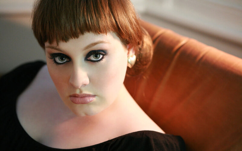 woman with bold makeup and red hair