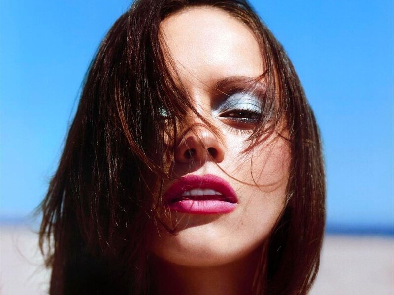 woman with bold makeup on beach