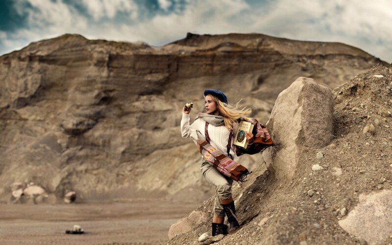 woman with book in desert