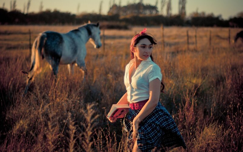 Woman with Book in Field