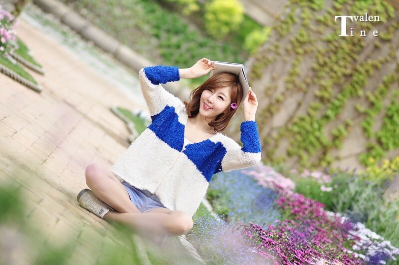 Woman with book in garden