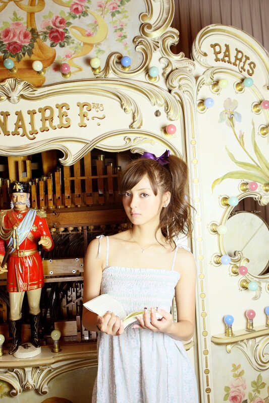 Woman with book in ornate room