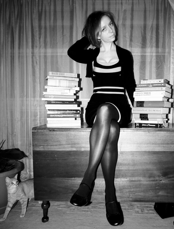 Woman with books and cat