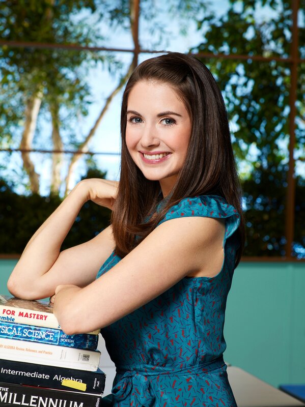 woman with books smiling