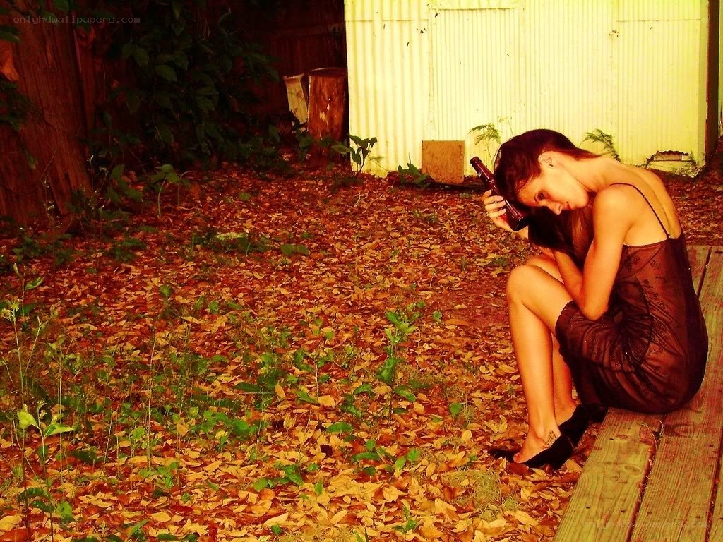 Woman with bottle in backyard