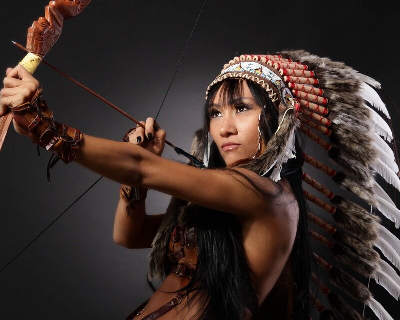Woman with Bow and Arrow — Black, Dramatic, Photograph, Feathered Headdress