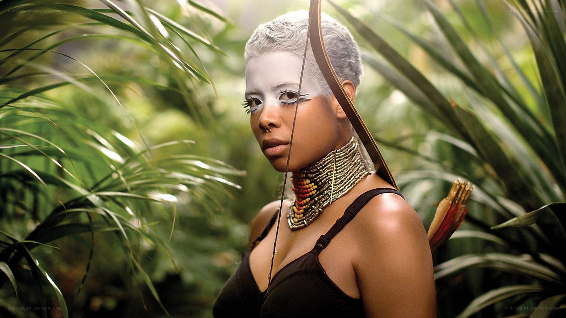 woman with bow in jungle
