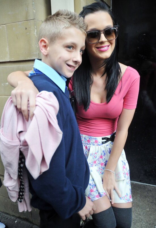 woman with boy in school uniform