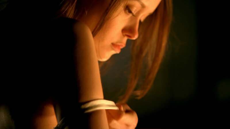 woman with bracelet in dim light