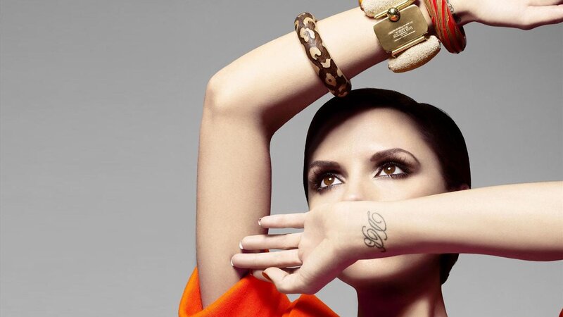 woman with bracelets and tattoo