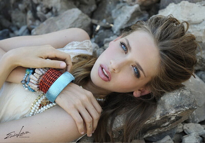 woman with bracelets on rocks