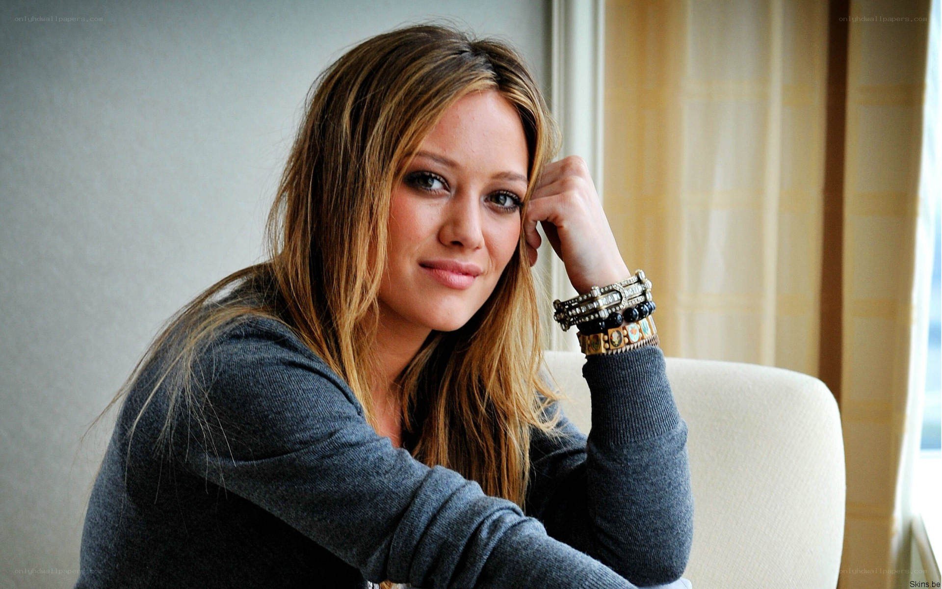 woman with bracelets smiling