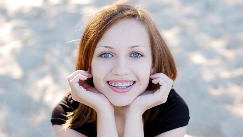 woman with braces smiling