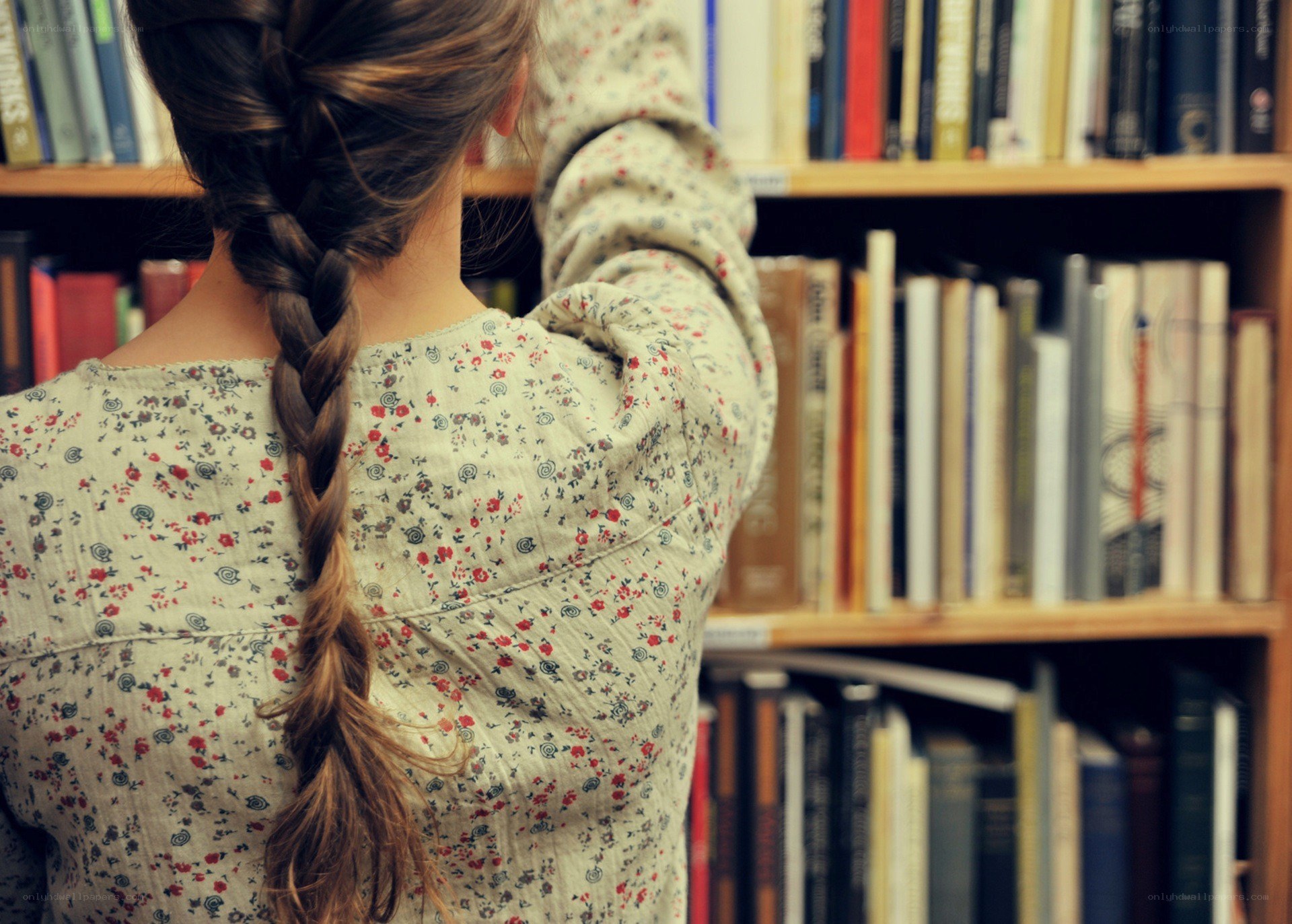 woman with braid in library