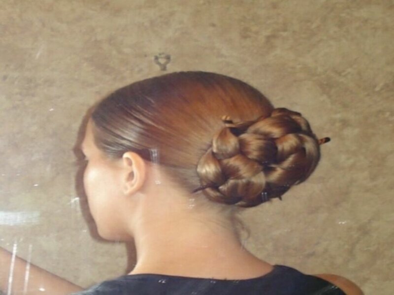 woman with braided bun hairstyle