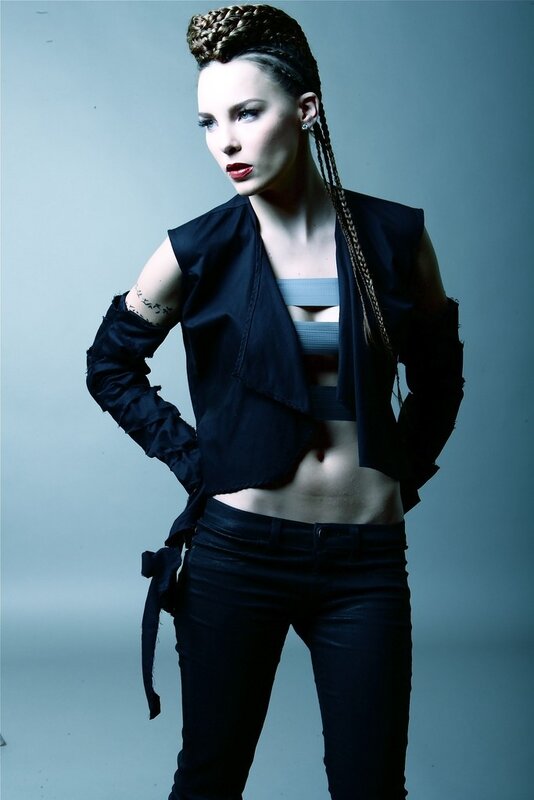 woman with braided hair in black outfit