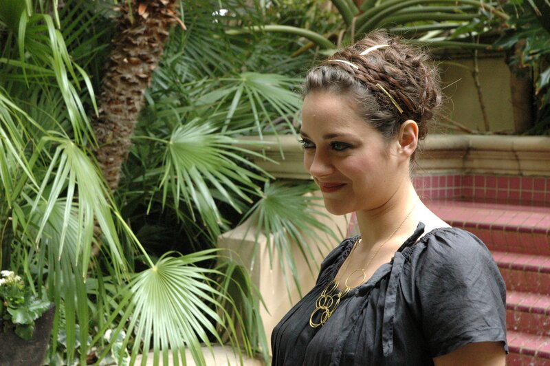 woman with braided hair in garden