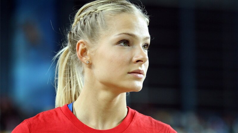 woman with braided hair in red shirt