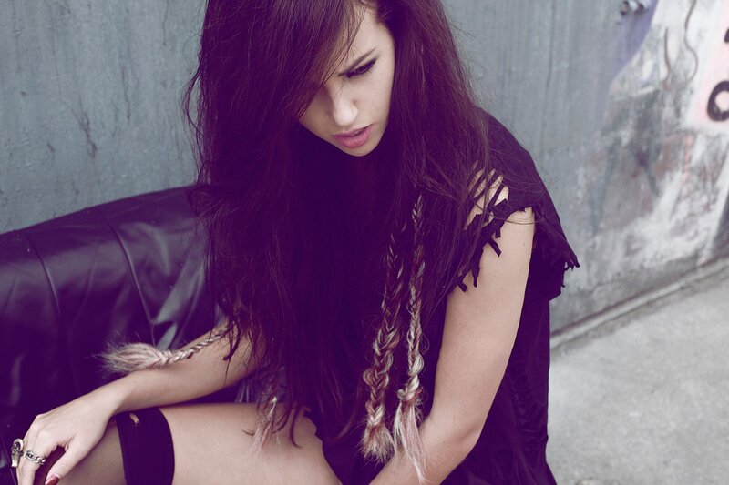 woman with braided hair sitting