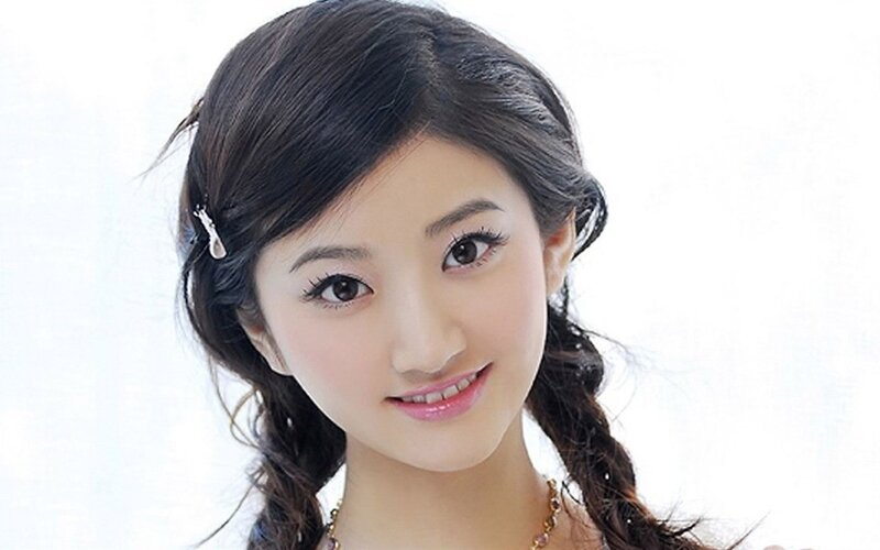 woman with braided hair smiling