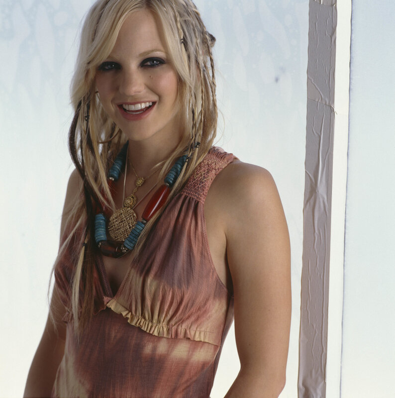 woman with braided hair smiling