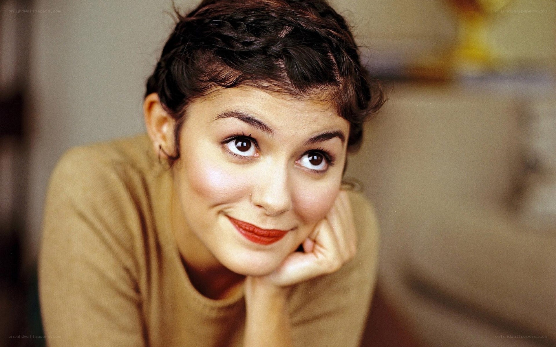 woman with braided hair smiling