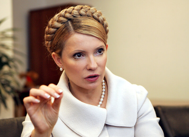 woman with braided hair speaking
