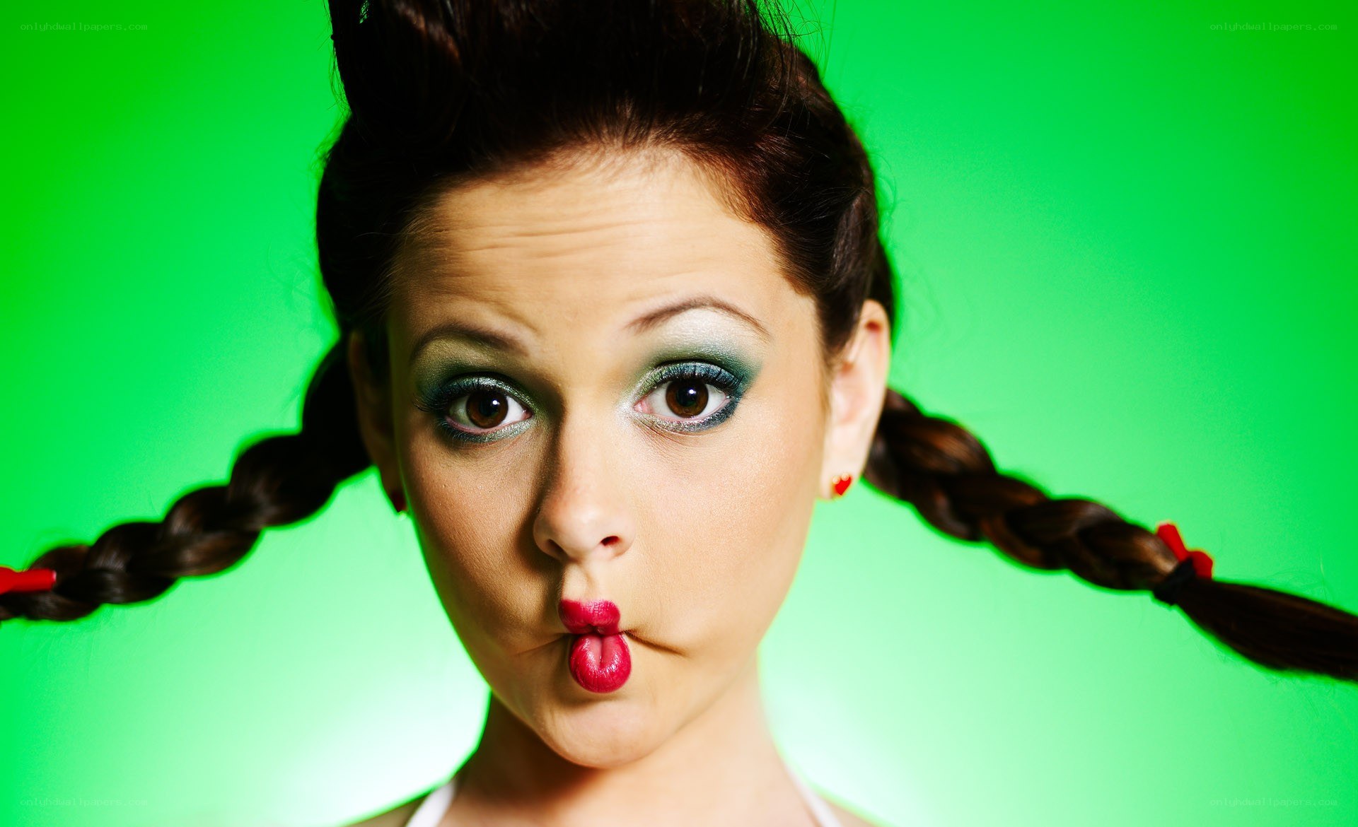 woman with braids making a face