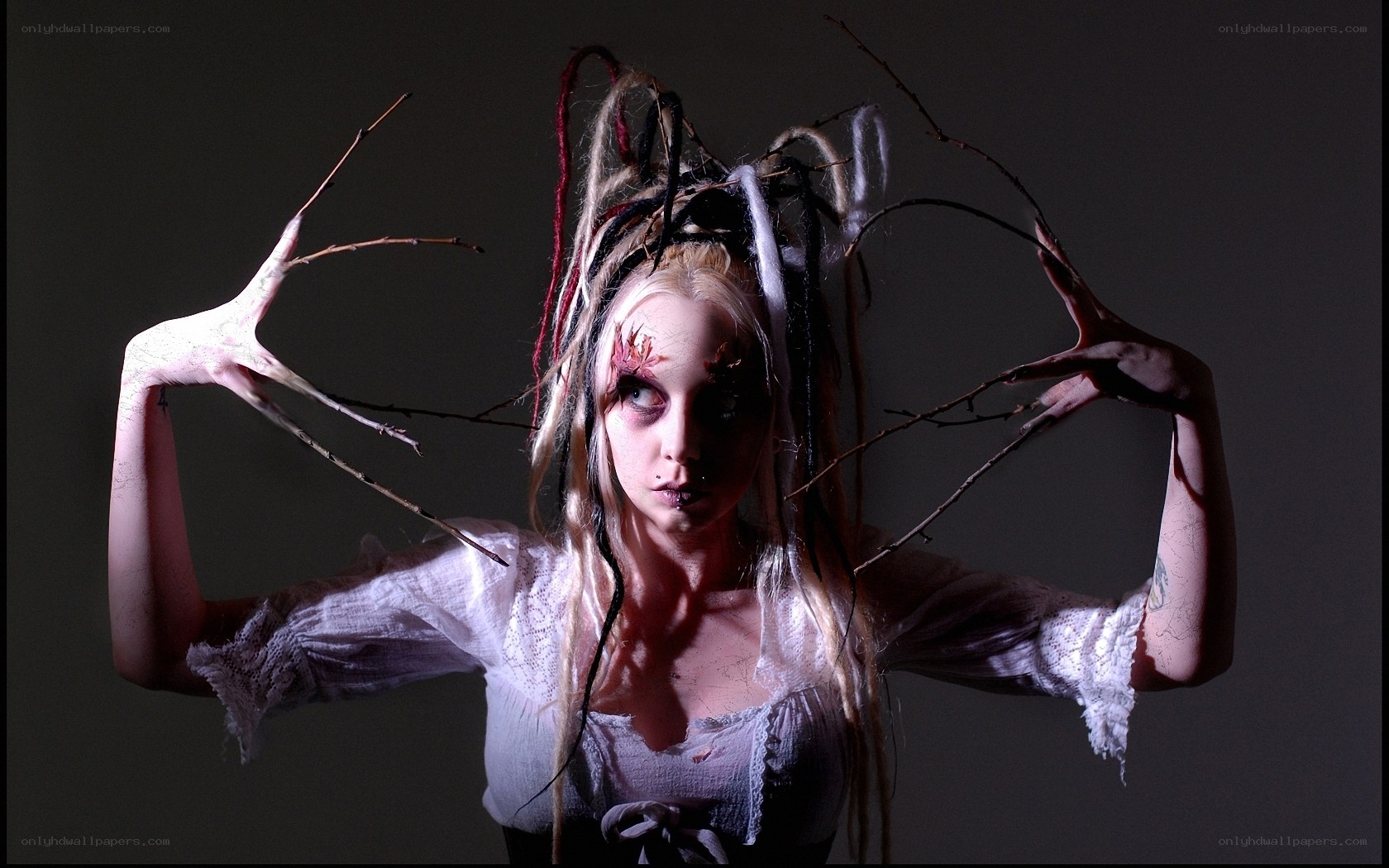 woman with branches and dreadlocks