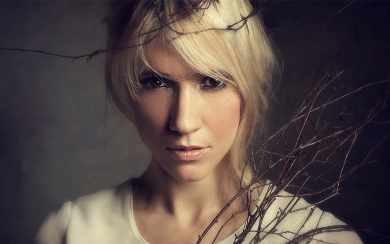 woman with branches in hair