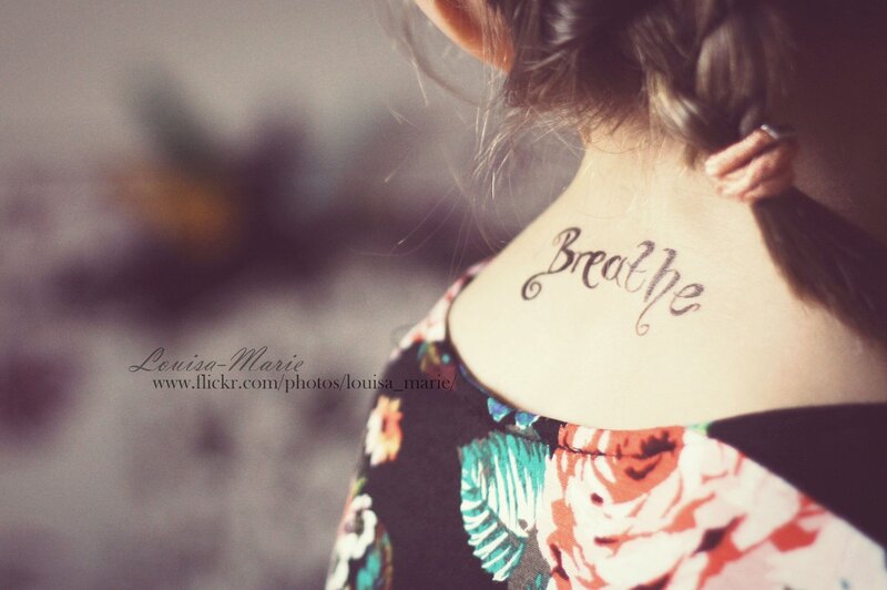 woman with breathe tattoo