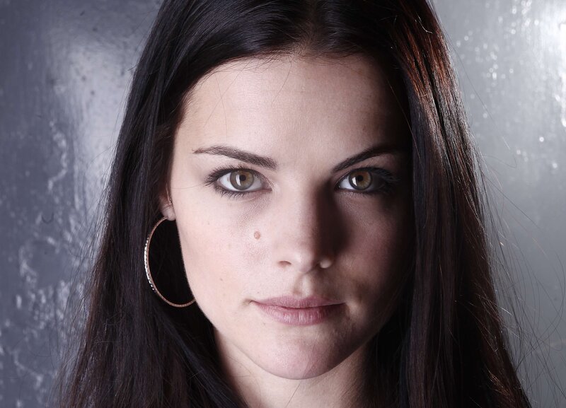 woman with brown eyes and hoop earrings