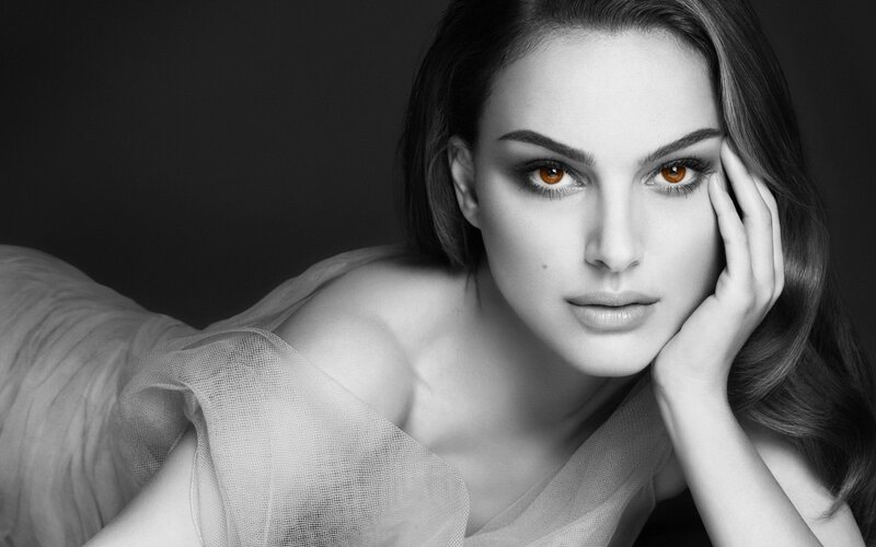 woman with brown eyes in black and white
