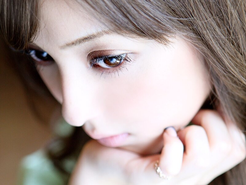 woman with brown eyes looking down