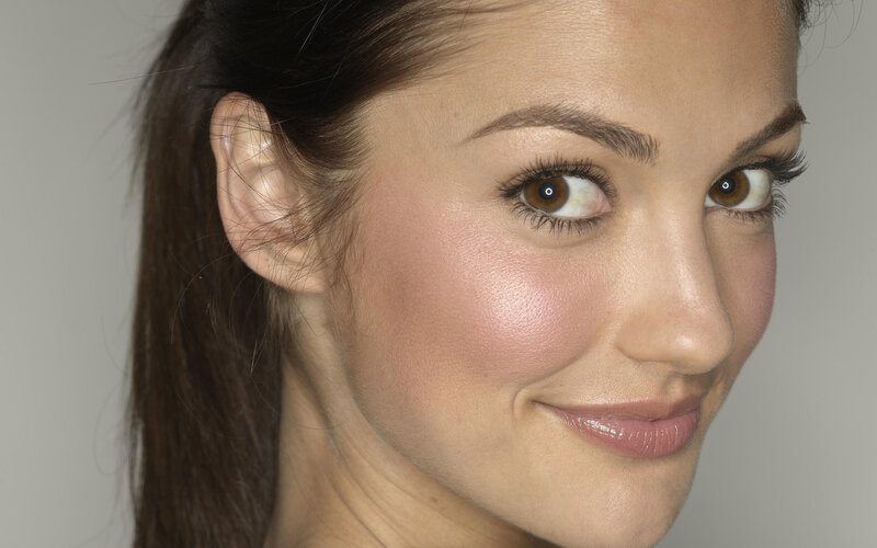 woman with brown eyes smiling
