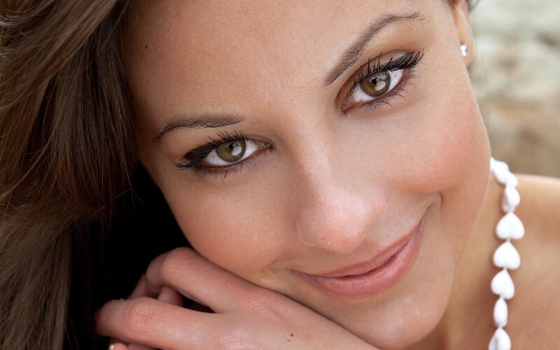woman with brown eyes smiling