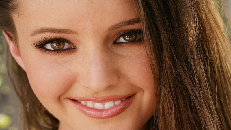 woman with brown eyes smiling