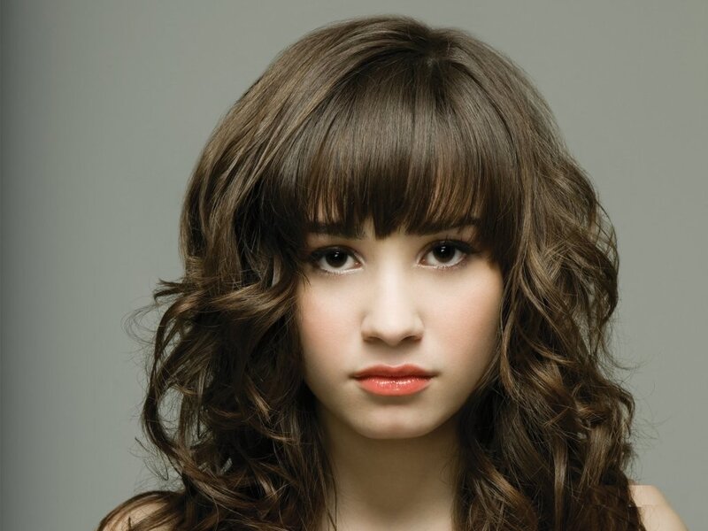woman with brown hair and bangs