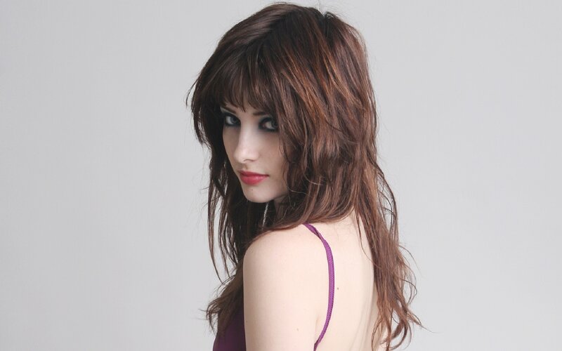 woman with brown hair and bangs