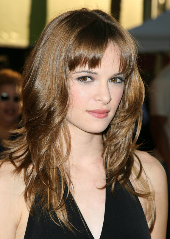 woman with brown hair and bangs