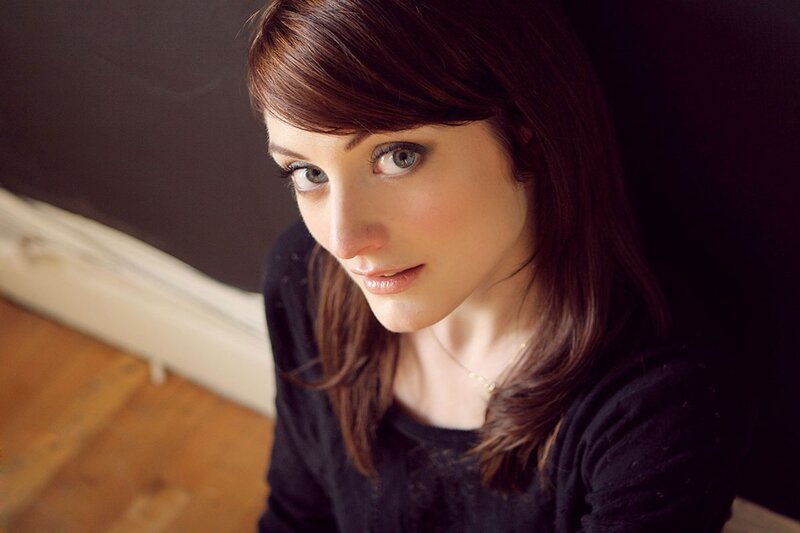 woman with brown hair and blue eyes