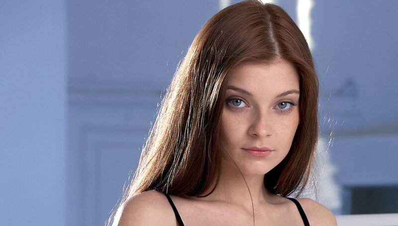 woman with brown hair and blue eyes