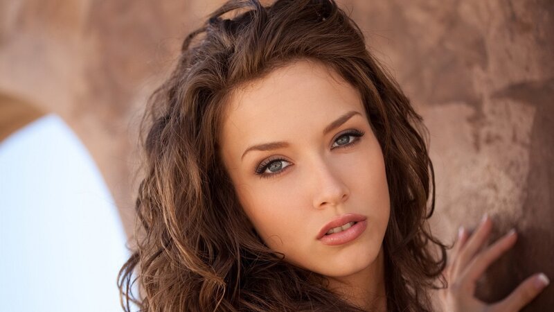 woman with brown hair and blue eyes