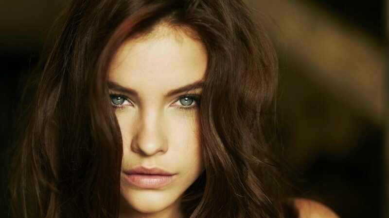 woman with brown hair and blue eyes