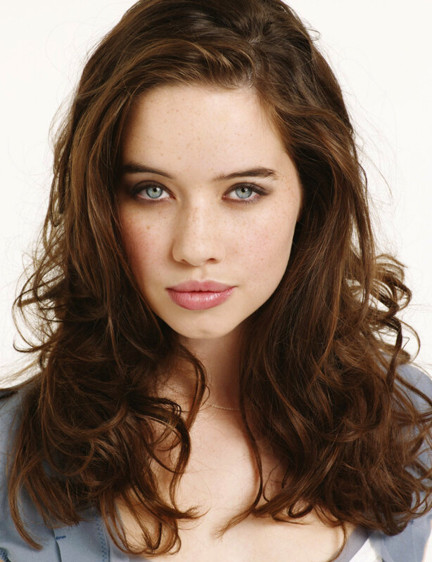 woman with brown hair and blue eyes