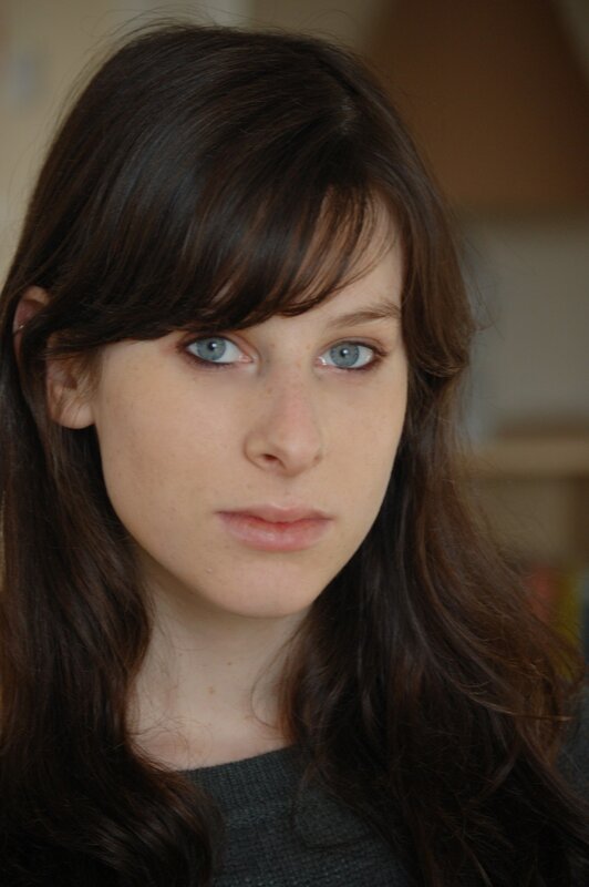 woman with brown hair and blue eyes